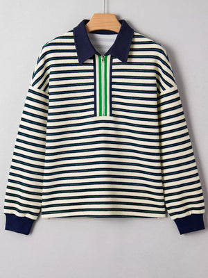 Striped long sleeve top with navy contrast collar and green zipper detail