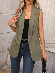 Moss shawl collar sleeveless vest coat with flap pockets, worn open over a black top.