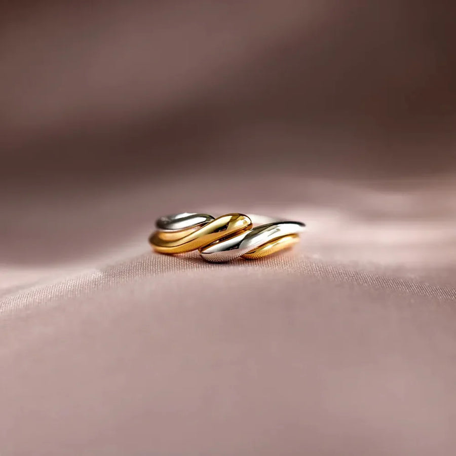 Two-tone gold open ring with intertwined design