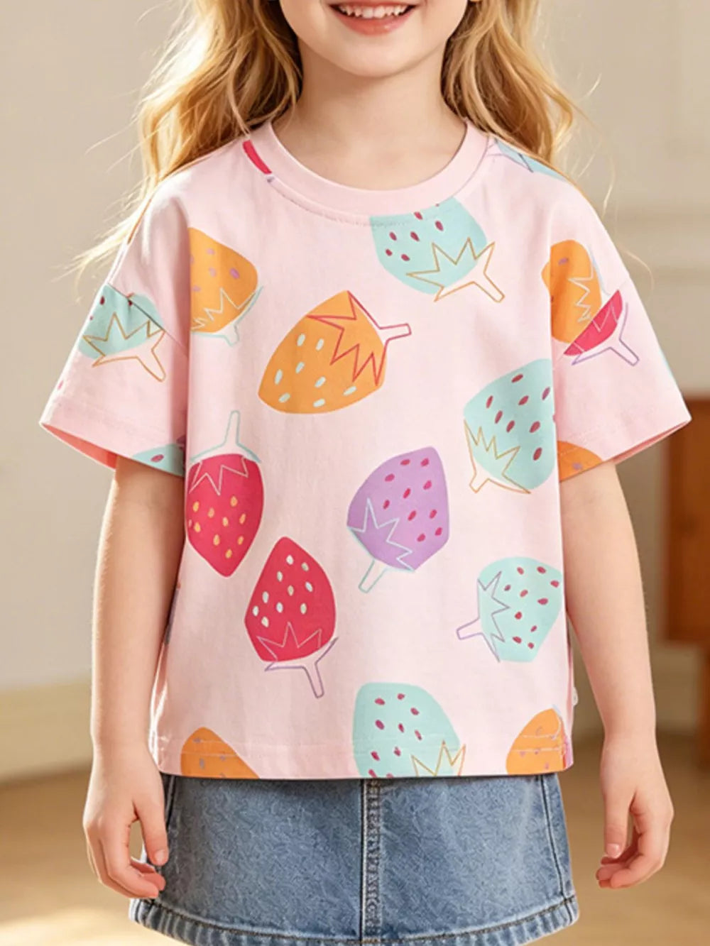 Pink cotton blend toddler t-shirt with colorful strawberry print, crew neck, short sleeves.