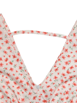 Floral v-neck mini dress with a zipper detail and a connecting strap across the neckline.