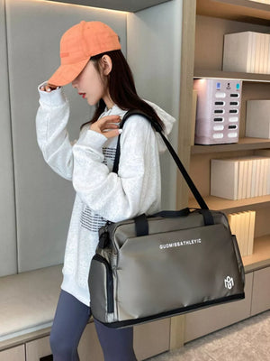 Premium Oxford cloth travel duffle bag in sage with adjustable strap and side pockets.