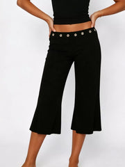Black flared hem capri pants with button detail at waist