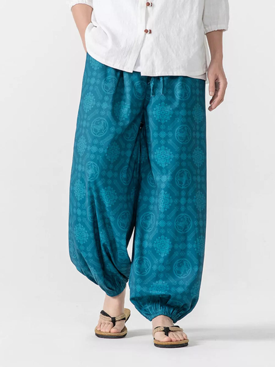 Blue patterned harem joggers with elastic cuffs and drawstring waist.