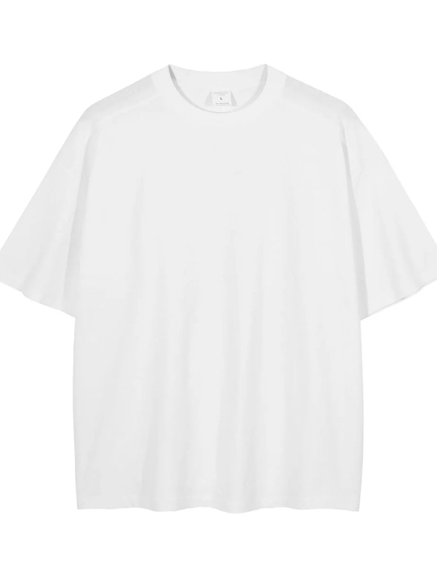Oversized white washed cotton tee with crew neck and short sleeves.