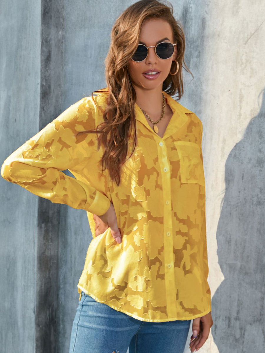 Yellow sheer button-down blouse with floral embroidery and long sleeves.