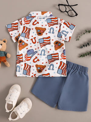 Toddler patriotic print short sleeve shirt with blue shorts.