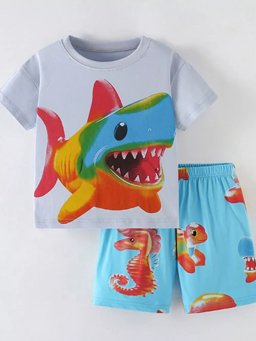 Boys' cotton blend t-shirt and shorts set with vibrant shark and seahorse prints.