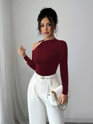 Burgundy one-shoulder t-shirt with cutout detail and gold hardware.