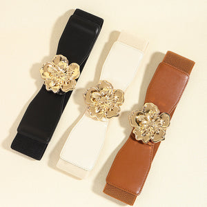 Floral buckle stretch waist cincher belt in black, ivory, and caramel with gold alloy flower detail.