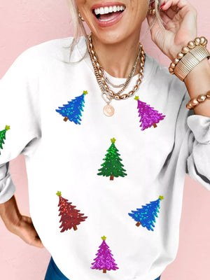 White sweatshirt with colorful sequin Christmas trees and stars.