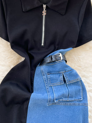 Belted denim midi dress with black top, zipper, and cargo pockets.