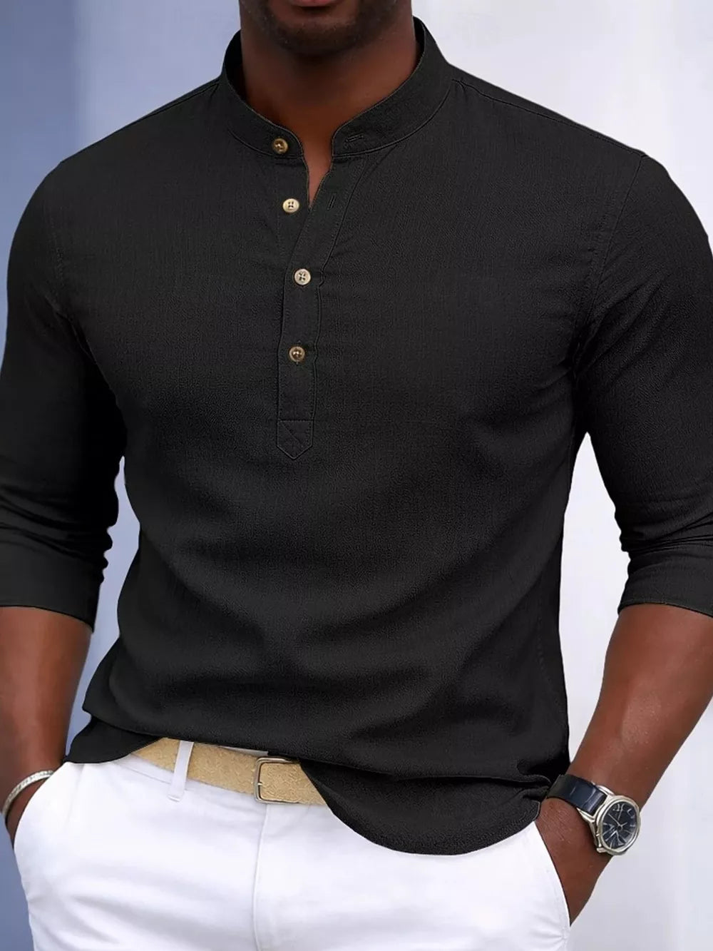 Black cotton blend men's henley shirt with button detail and banded collar.