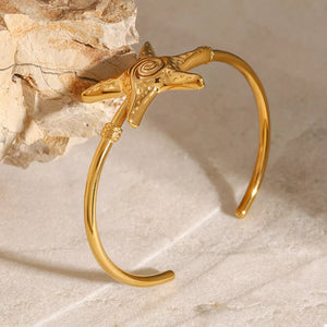 bracelet featuring starfish motif in gold with 18K Gold-Plated, Stainless Steel Care instructions: Avoid wearing during