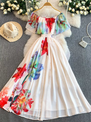 Botanical off-shoulder A-line dress in light pink with floral print and belted waist.