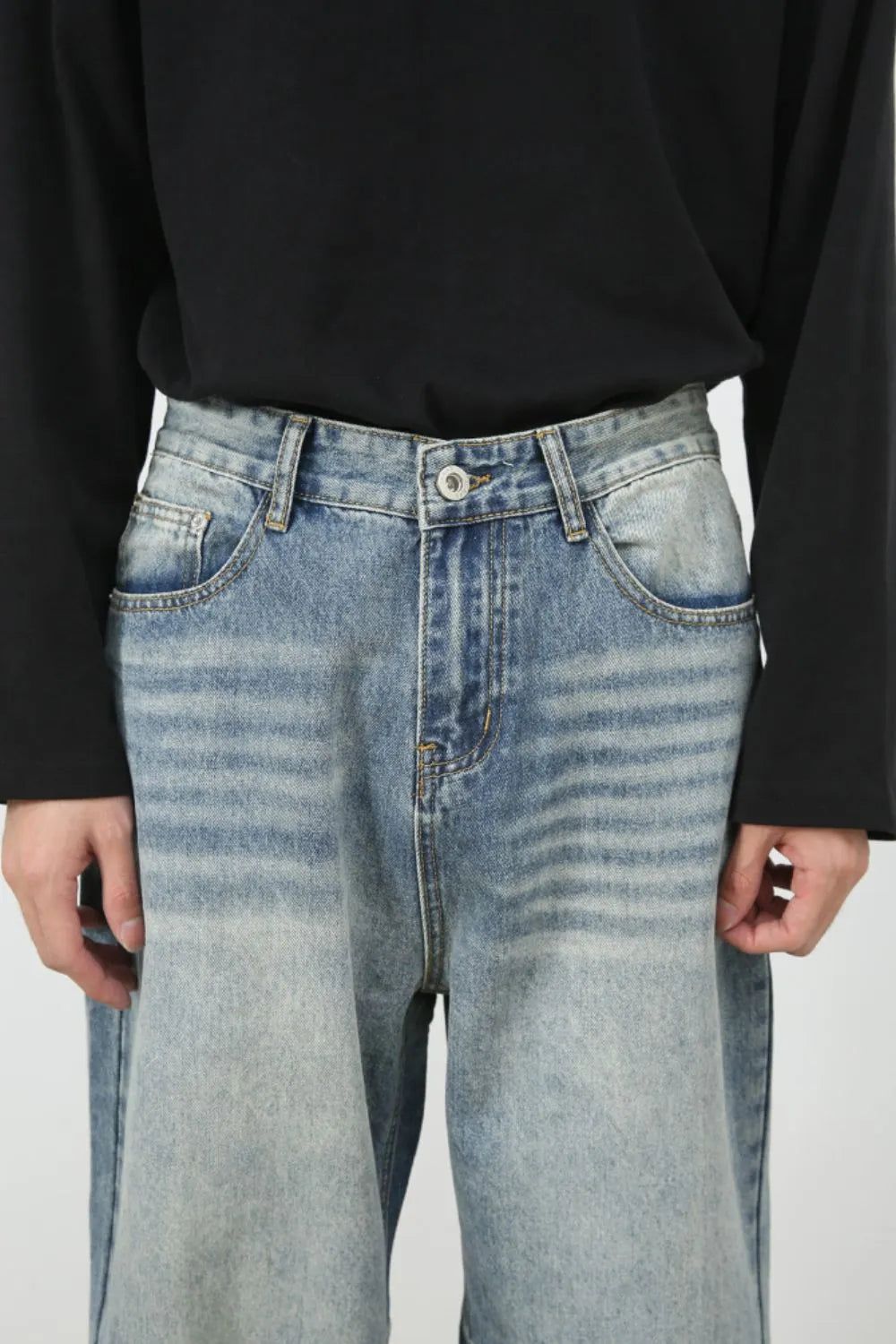 Baggy wash denim jeans in medium blue with a relaxed fit and classic five-pocket styling.
