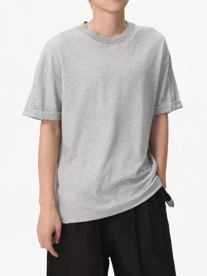 Sleek grey cotton t-shirt with a round neck and cuffed short sleeves.