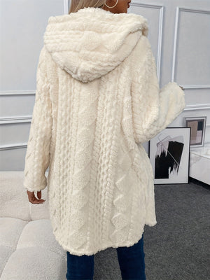 Cream textured teddy bear coat with hood and cable knit pattern.