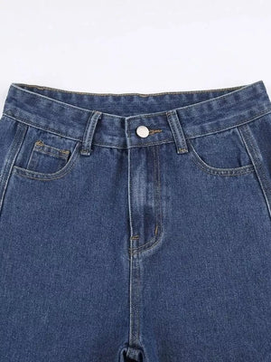 Blue denim jeans with distressed side cutouts and lace-up detail.
