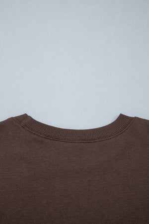 dark brown sweatshirt with ribbed cuffs and long sleeve