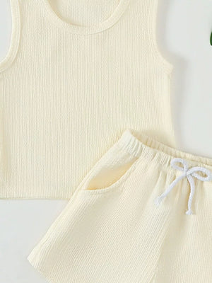Cream ribbed tank top and shorts set with drawstring waist and pockets.
