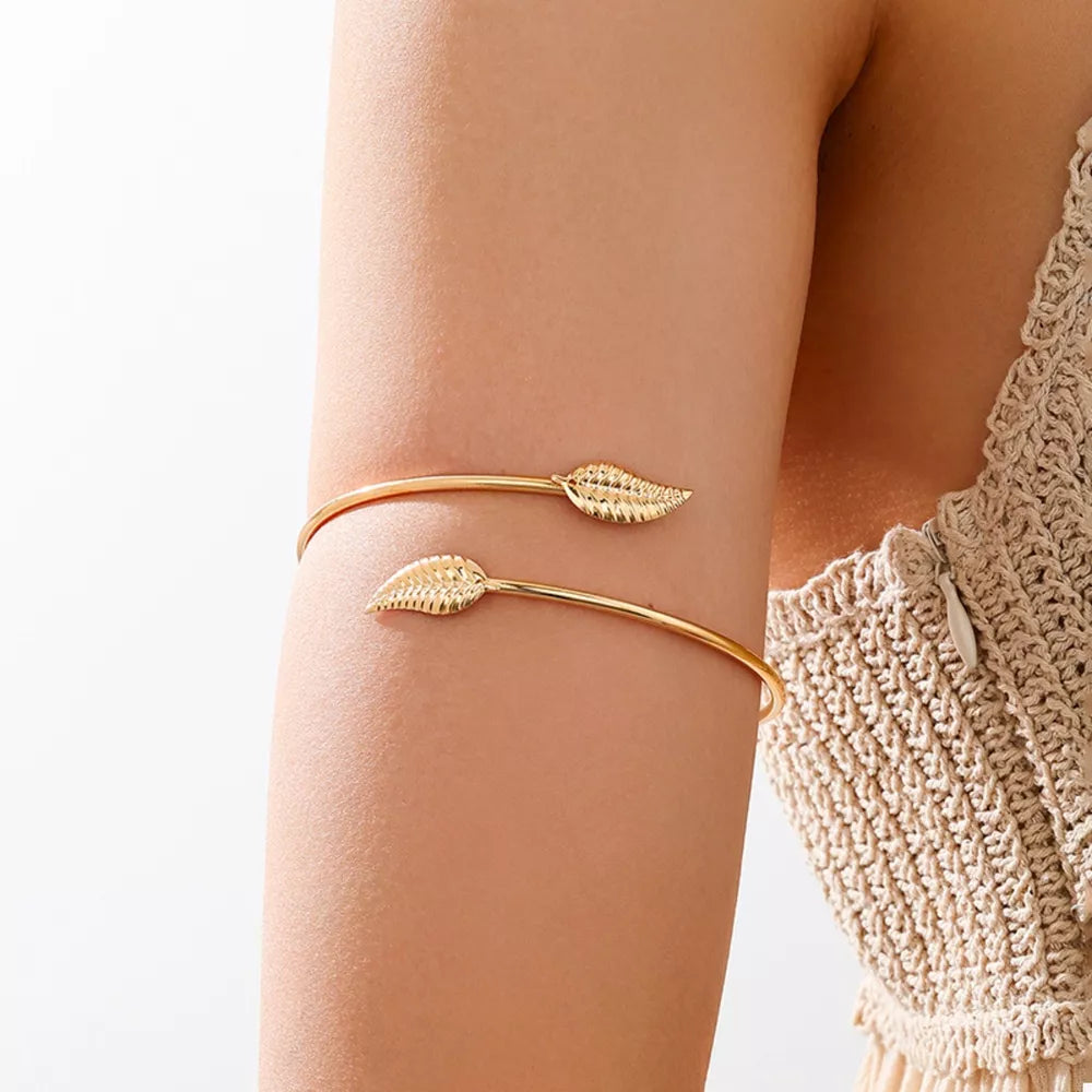 bracelet in gold featuring open cuff and fitted fit
