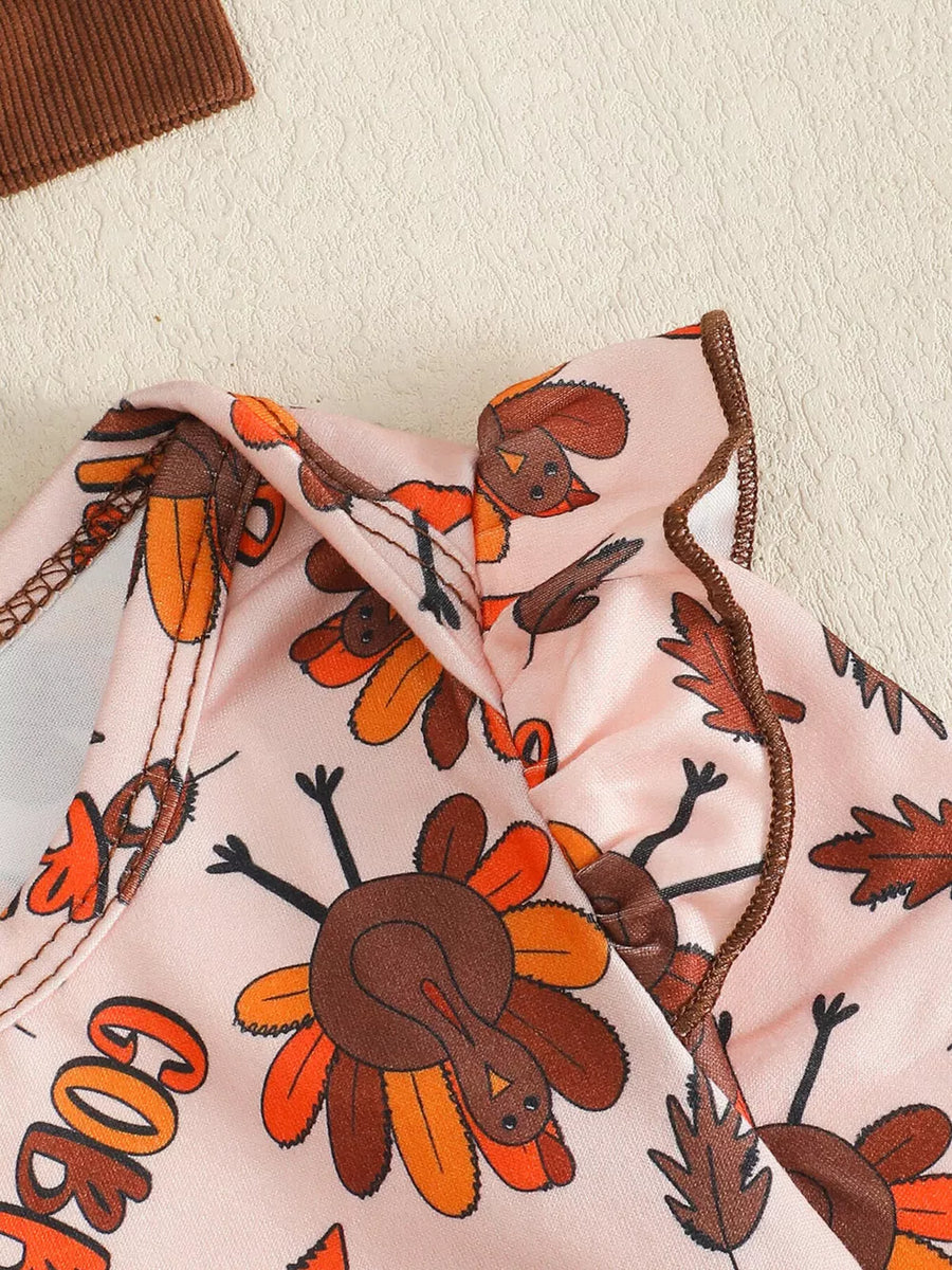 Baby bodysuit with Thanksgiving turkey print and ruffled neckline.
