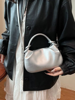 Mini ruched crossbody bag in silver with knotted top handle and tassel detail