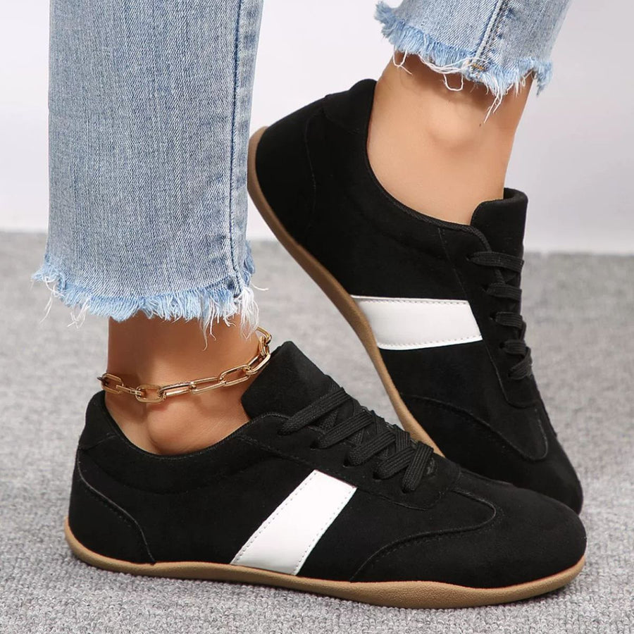 dark brown sneakers featuring round toe and color-block