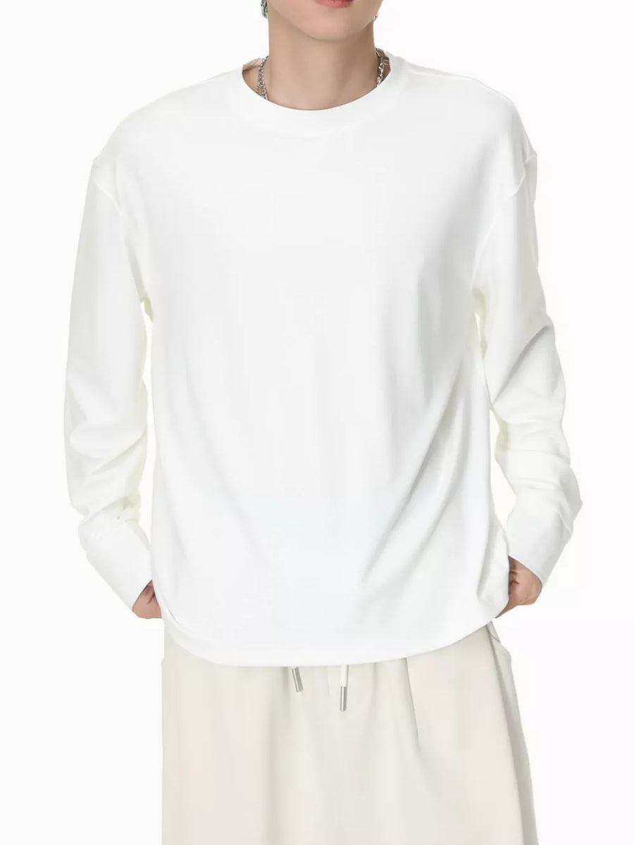 White cotton relaxed fit long sleeve t-shirt with crew neck.