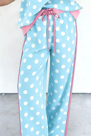 Polka dot pajama pants with pink trim and drawstring waist