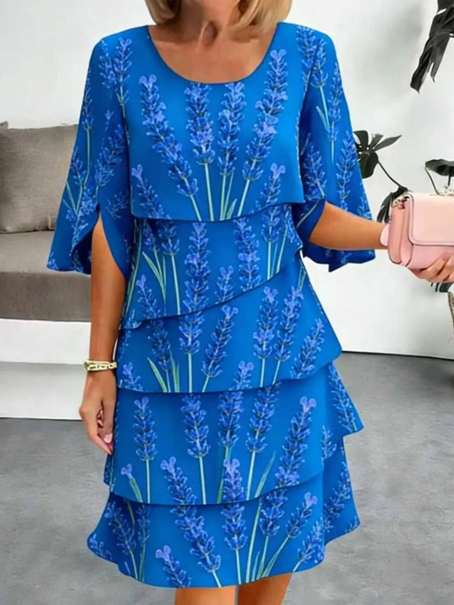 Blue floral tiered ruffle hem dress with split sleeves and above-knee length.