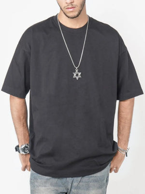 Black oversized crew neck t-shirt with short sleeves and a relaxed fit.