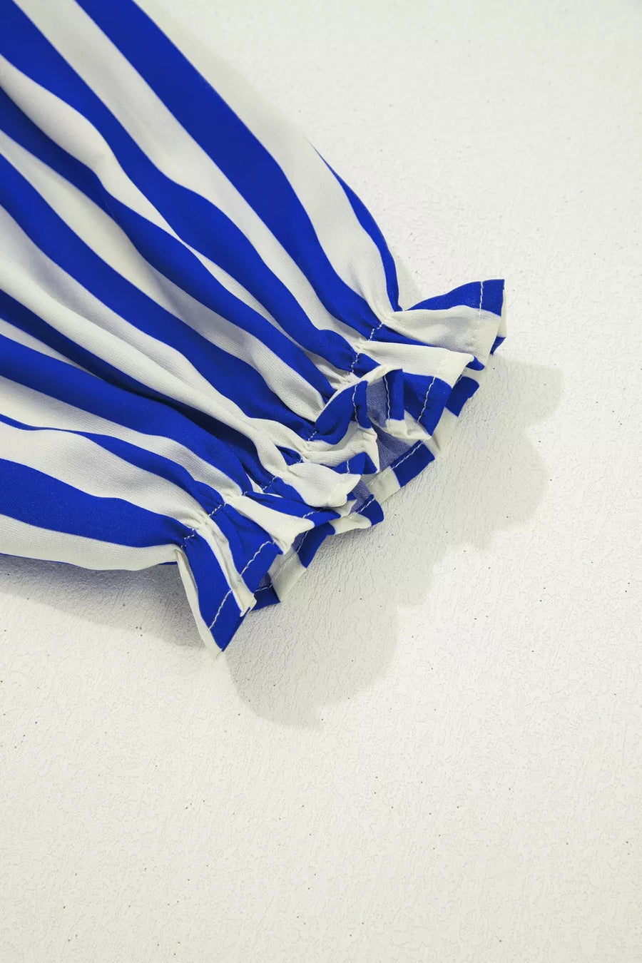 Blue and white striped shirt with ruffled balloon sleeves