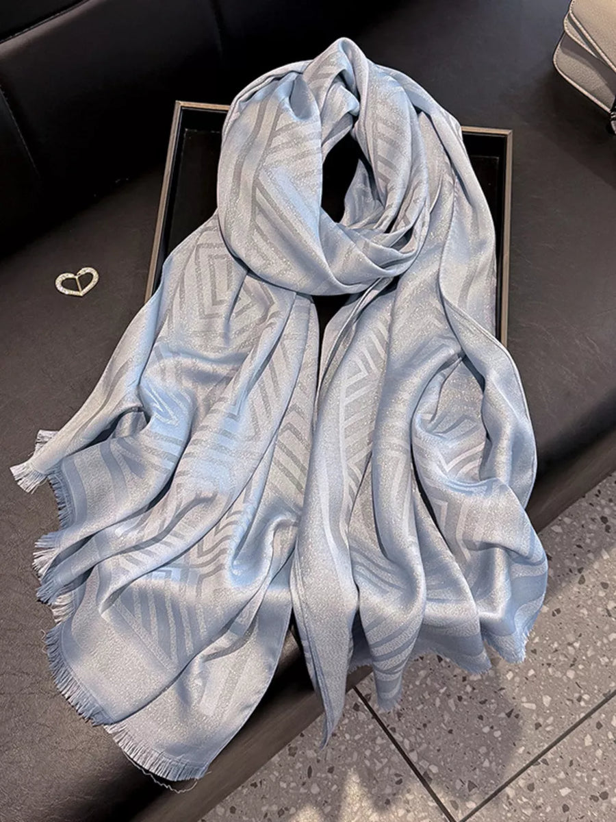 Elegant blue Tencel cotton scarf with geometric pattern and fringe detail