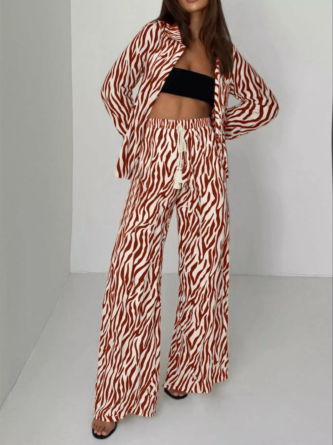 Brown zebra print relaxed fit two-piece set with wide leg pants and a button-up shirt.