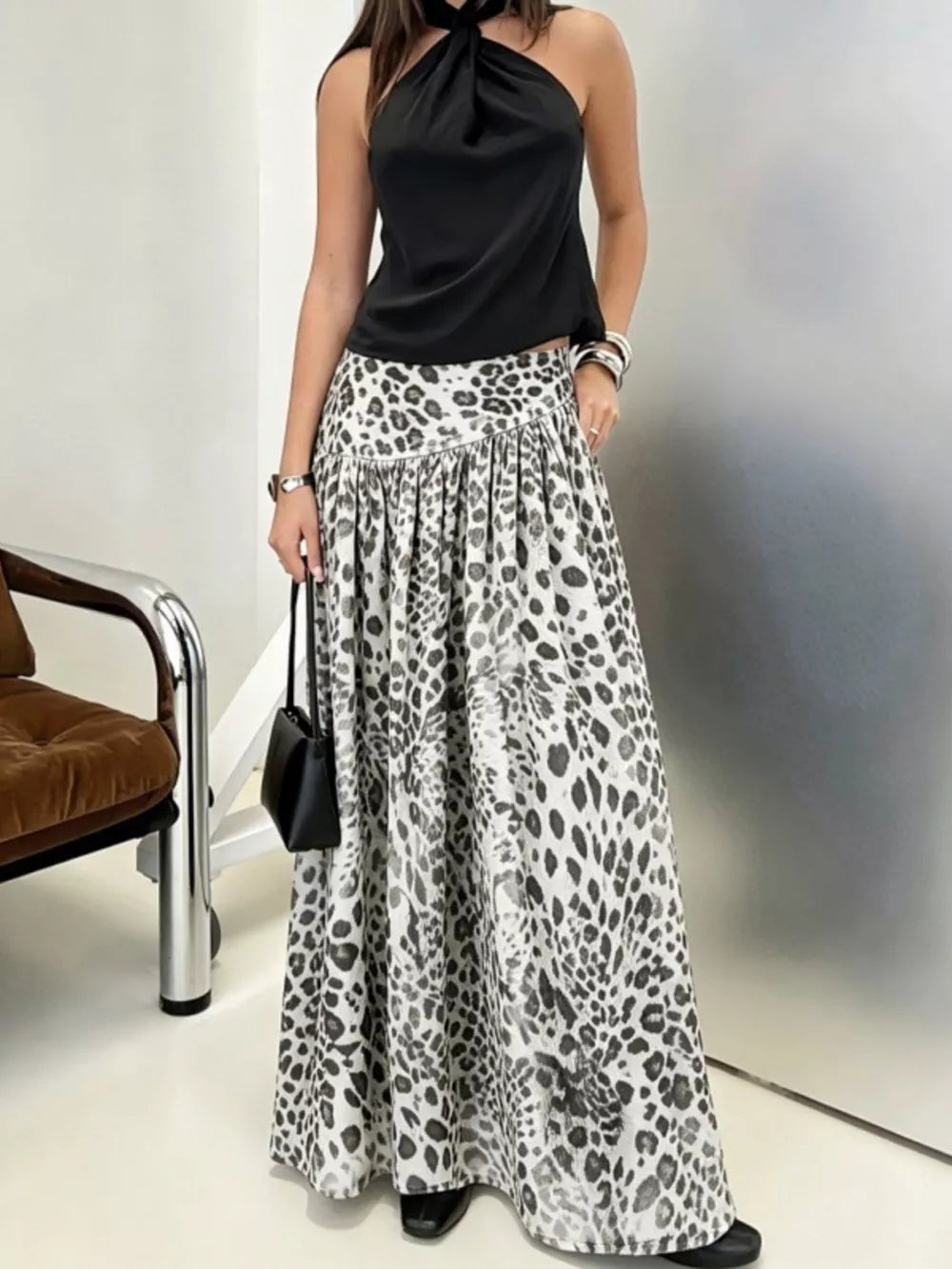 100% polyester Care instructions: Machine wash cold maxi skirt in Gray with flared silhouette