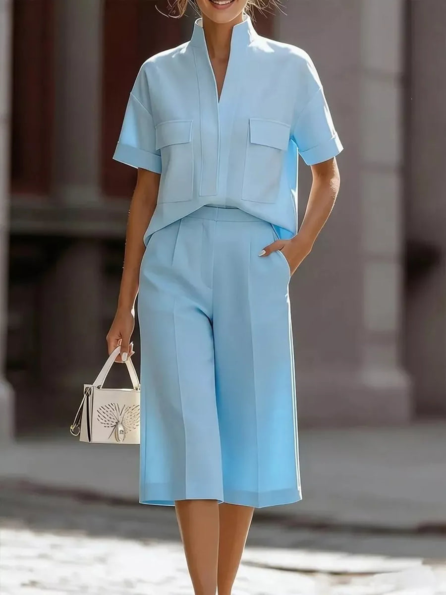 Sky blue two-piece set with pocketed shirt and culottes.
