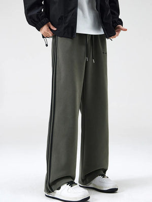 Men's army green sweatpants with black side stripes and drawstring waist