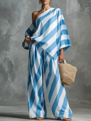 Blue and white striped one-shoulder top with wide-leg pants, flowy silhouette