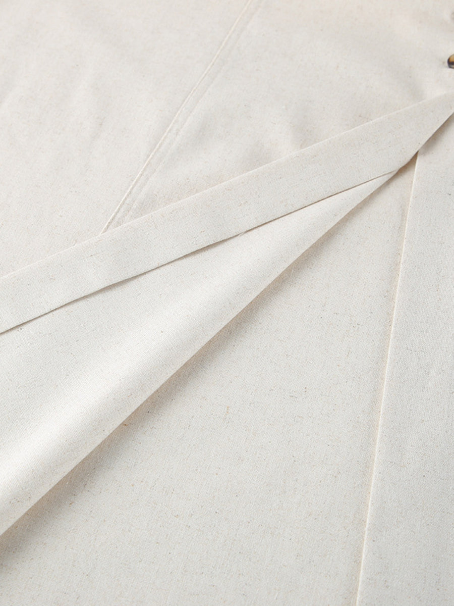 Button front tube maxi dress in beige cotton blend fabric with visible button detail.