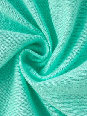 Mint green knit fabric with a subtle ribbed texture, swirled and folded.