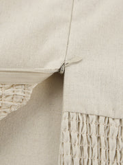 Beige cotton smocked tube dress detail showing zipper and smocked texture.