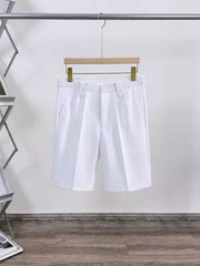 White pleated chino shorts for men with pockets and button closure.