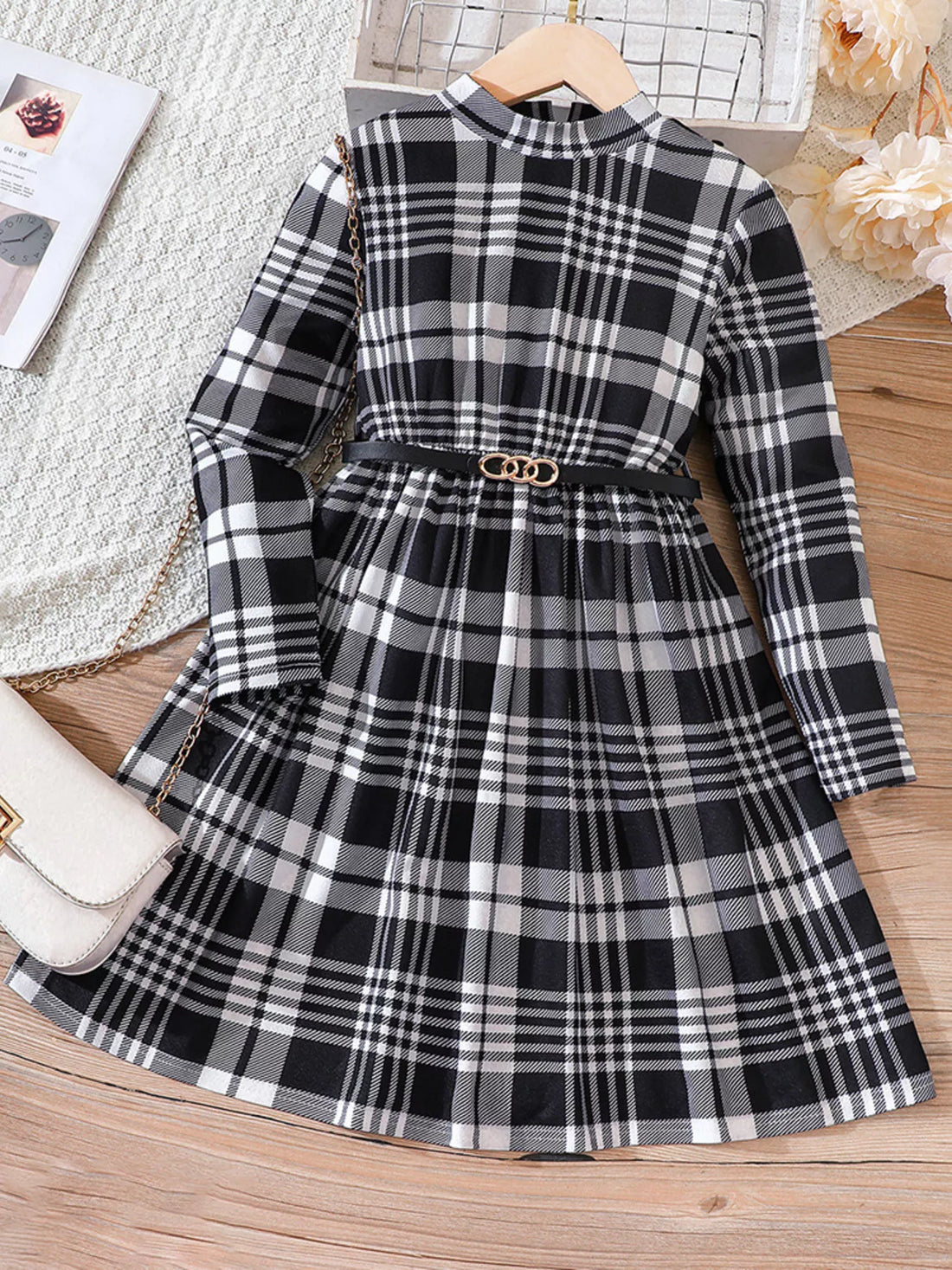 Baby girls' black and white plaid long-sleeve belted dress with a mock neckline.