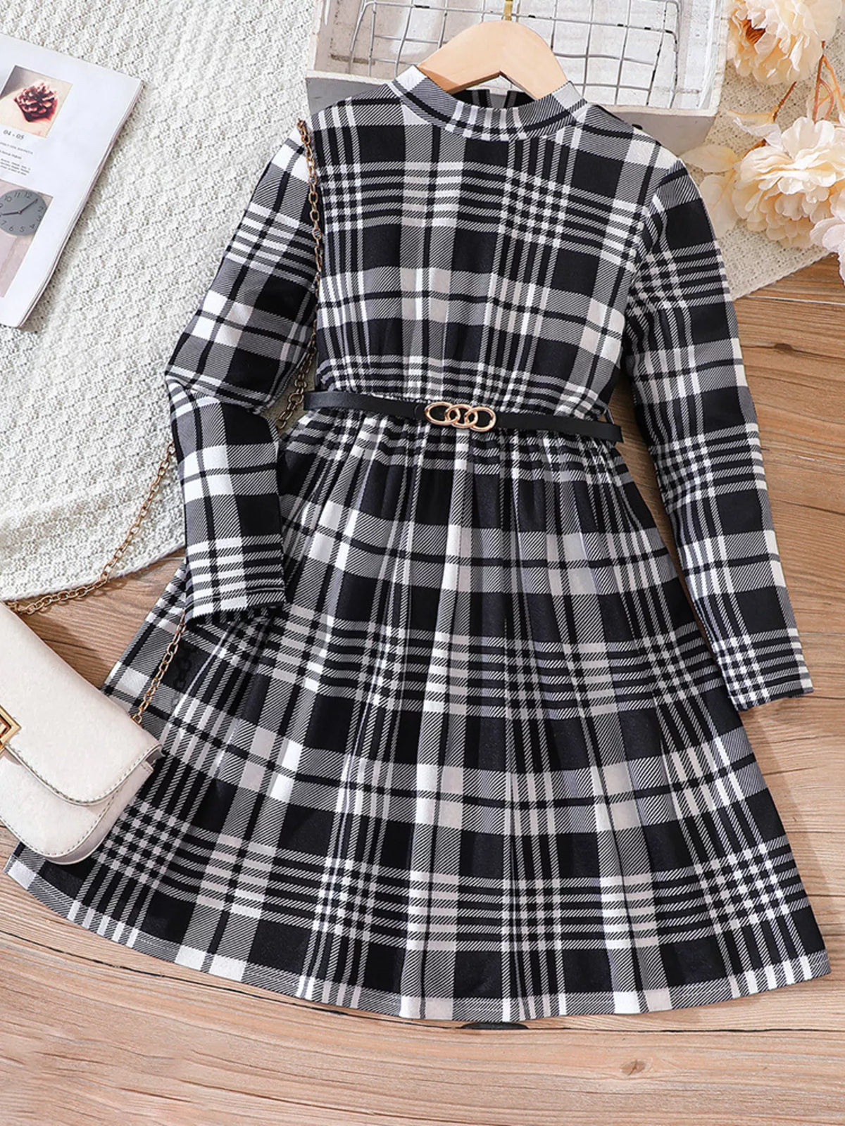 Baby girls' black and white plaid long-sleeve belted dress with a mock neckline.