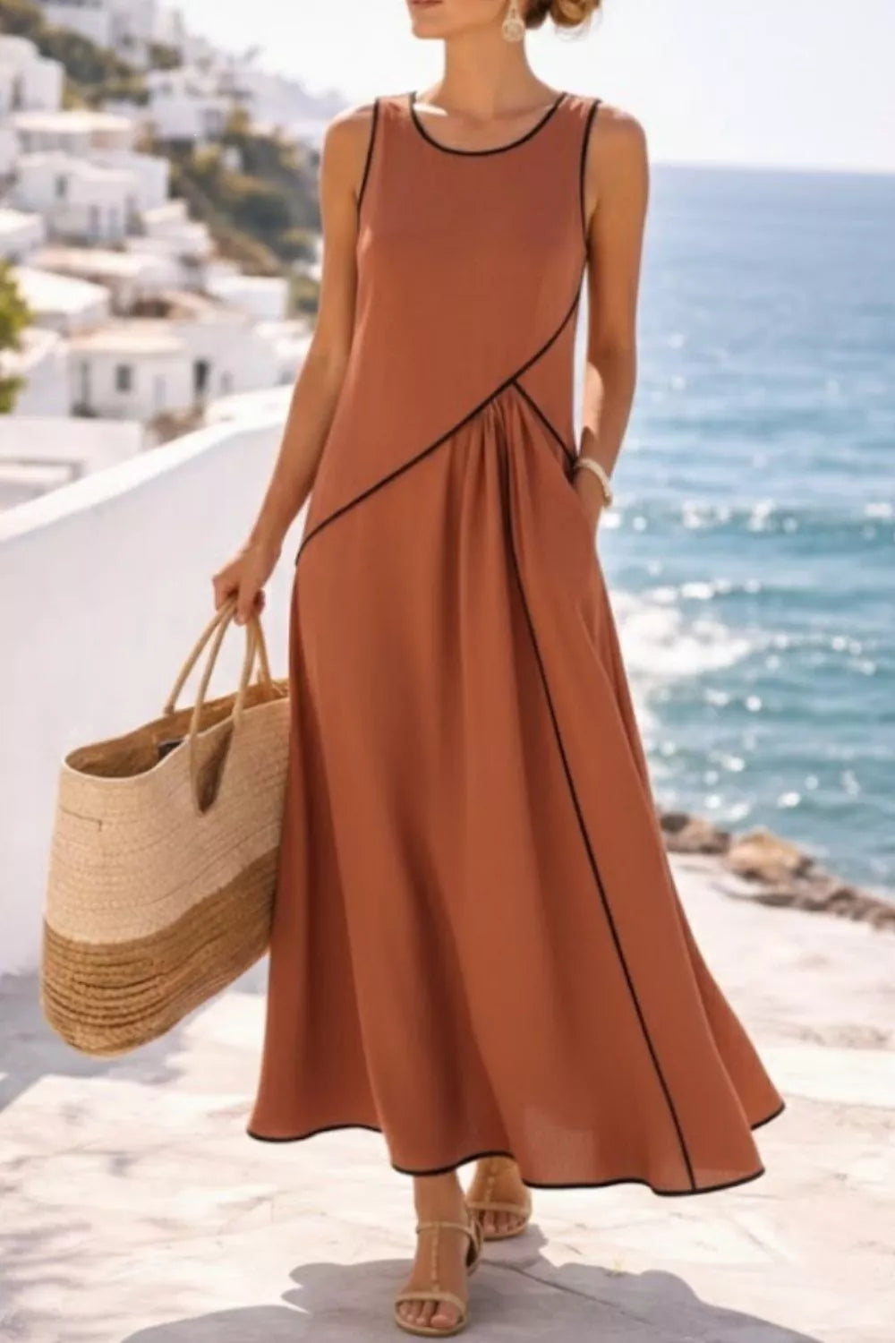 Caramel maxi dress with black contrast piping and side pockets, sleeveless with round neckline.