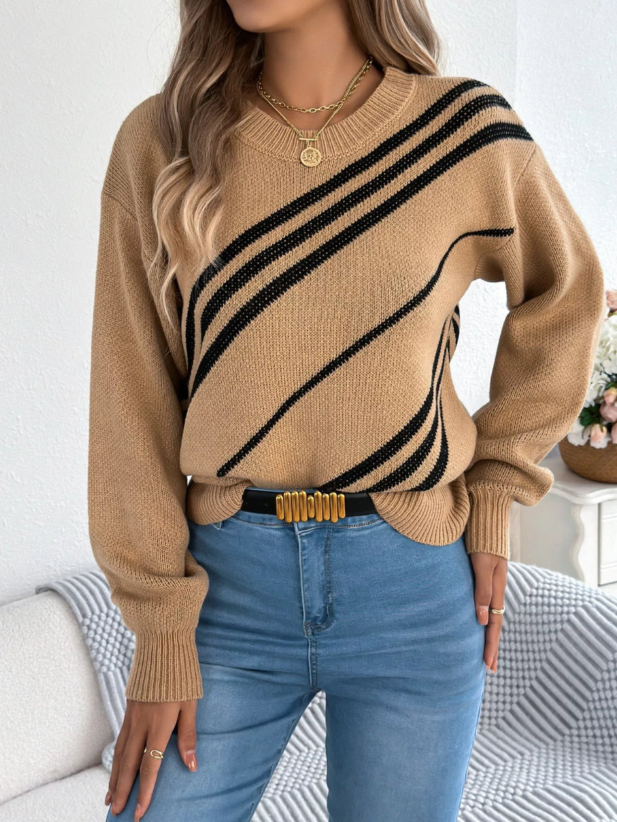 Khaki acrylic blend sweater with black diagonal stripes, round neck, and long sleeves.