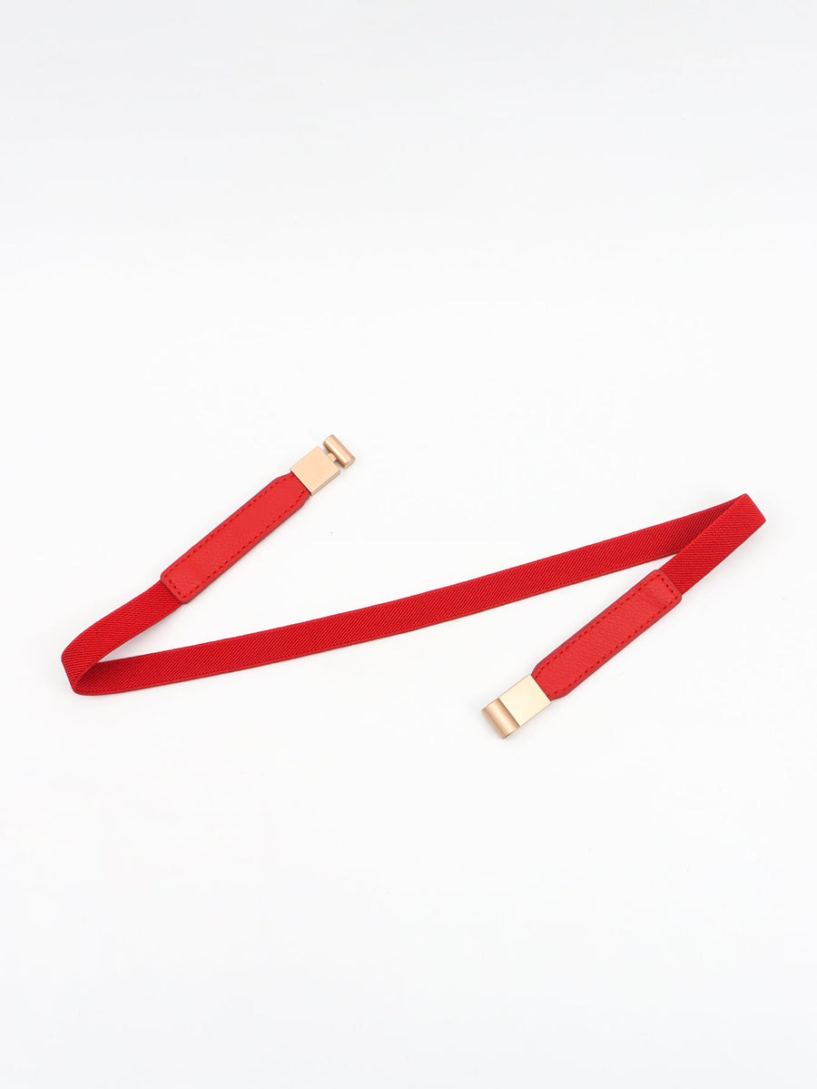 Red elasticated buckle belt with leather detail and gold hardware