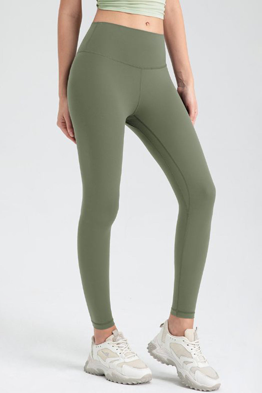Matcha green high-waist performance leggings with sculpted seams and a smooth finish.